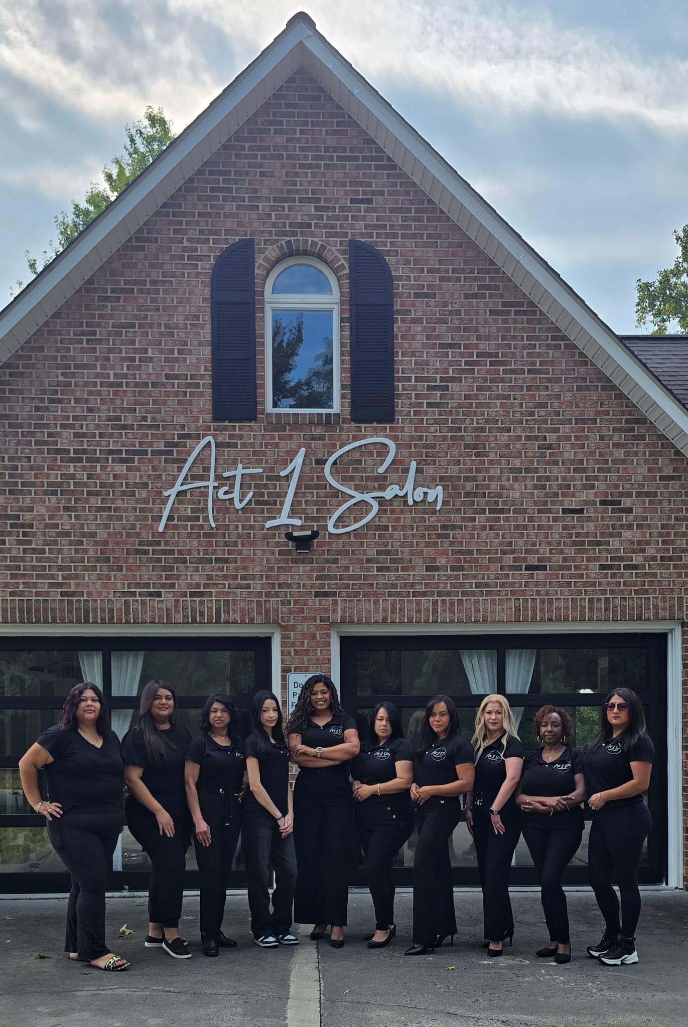 The Act 1 Salon & Spa team standing together outside the salon